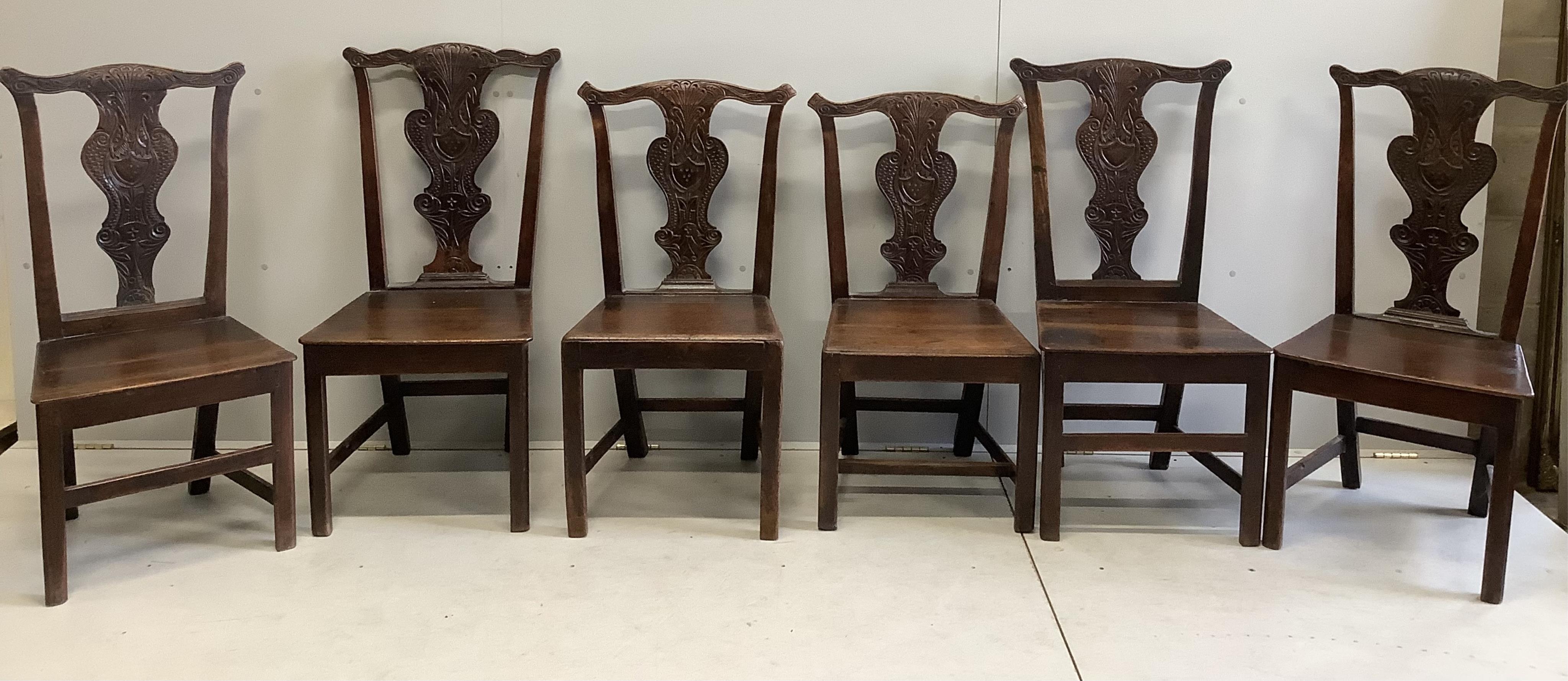 A harlequin set of six country Chippendale style, carved oak dining chairs. Condition - fair